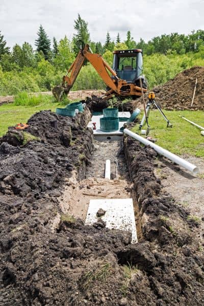 Perc test soil changes denver - ALTA SURVEY Colorado Excavator trench work showing how soil disturbance can affect perc test results in Denver