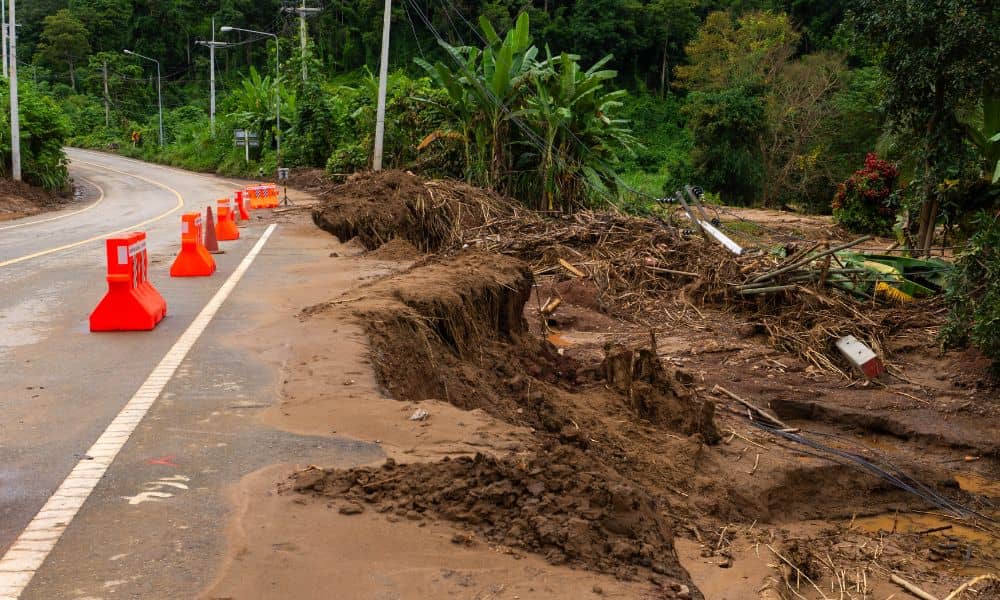 Roadway landslide slope failure scene - ALTA SURVEY Colorado A damaged roadway after a landslide, showing how geotechnical engineering helps identify unstable soil and prevent failures