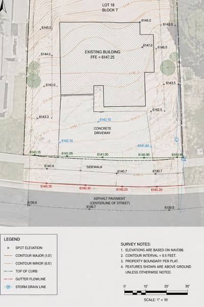 Survey plan showing elevation points and contour lines near a curb and sidewalk in a topographic survey
